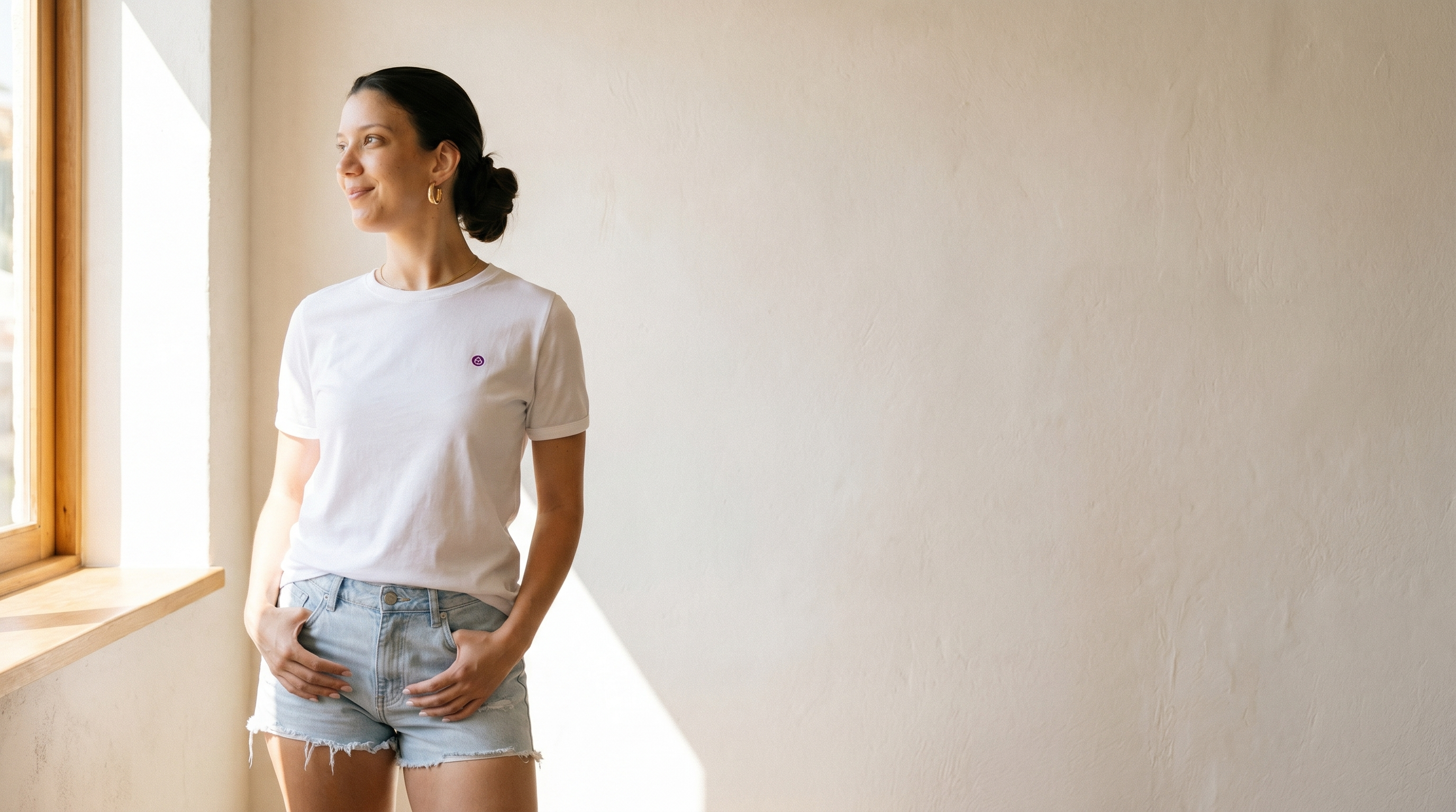 CALLURIC hero - woman in white organic cotton t-shirt